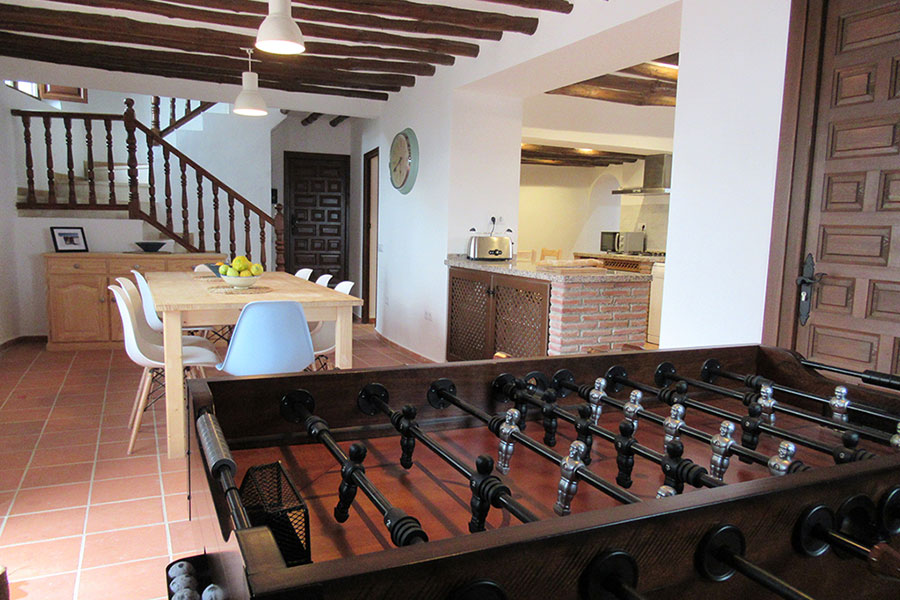 Open plan kitchen dining room with fusbal table